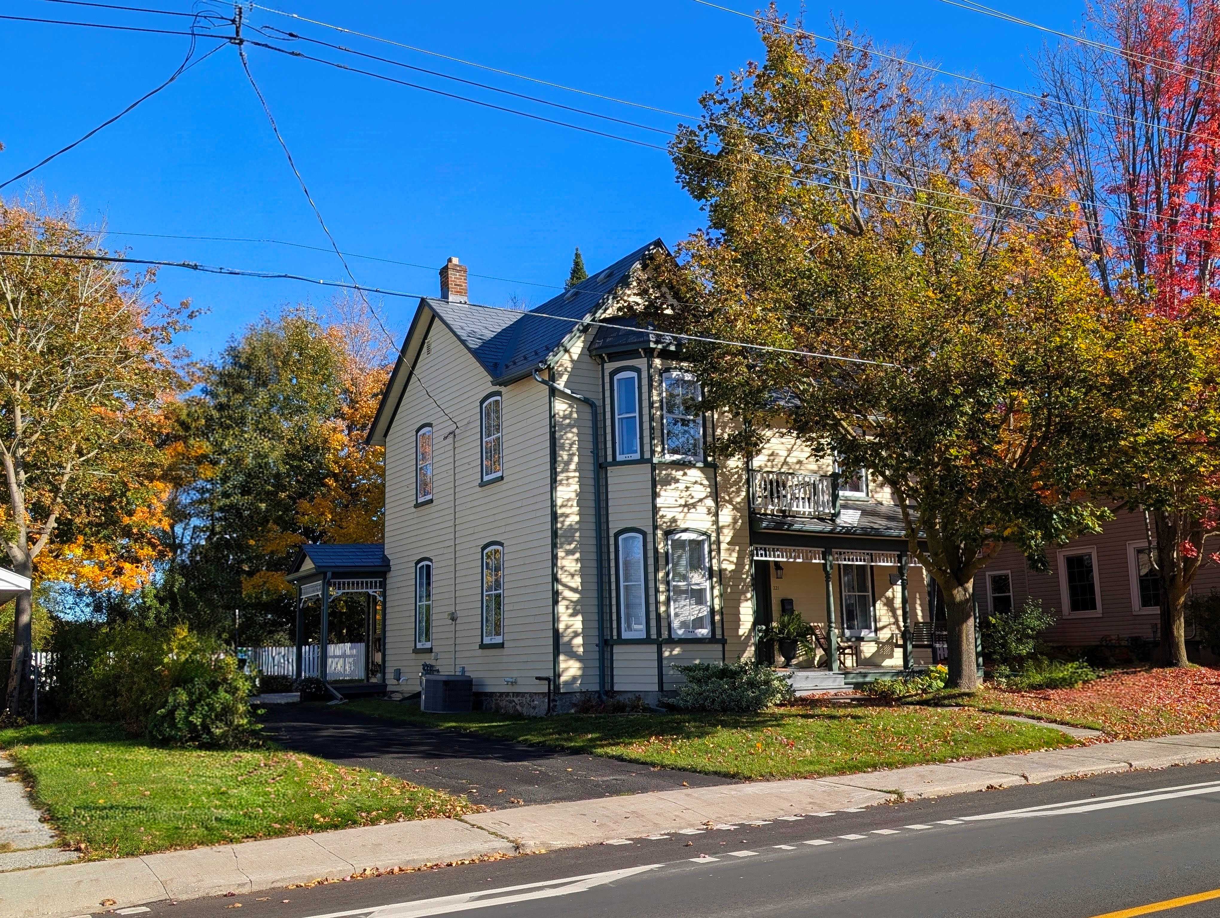 221 Prospect Street photographed from the street on a sunny autumn day in October 2026